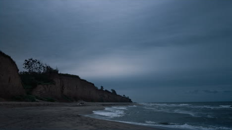 Dark-sea-coast-wave-breaking-evening-beach-landscape.-Ocean-nature-background.