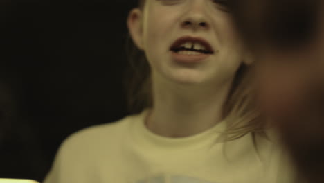 Closeup-diverse-pupils-shouting-on-conflict-victim-standing-school-hall-together