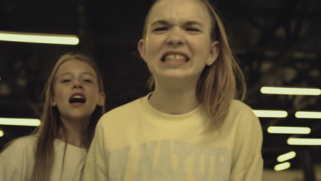 Angry-bullies-threaten-classmate-shouting-in-corridor-closeup.-Bullying-concept.