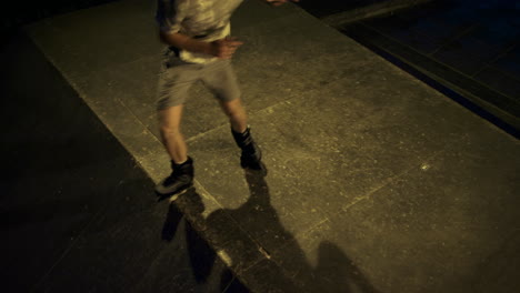 Young-roller-skater-practicing-at-skate-park.-Extreme-man-on-roller-skates