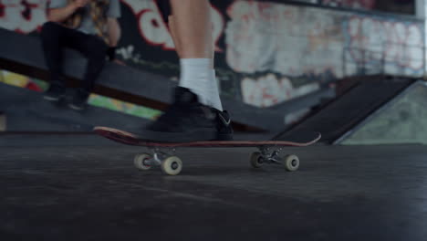 Extreme-teenager-skateboarding-in-urban-skatepark.-Teenager-riding-on-skate.