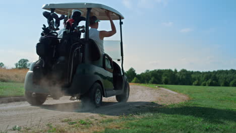 Golf-couple-driving-cart-on-fairway.-Players-team-ride-buggy-car-on-summer-day.