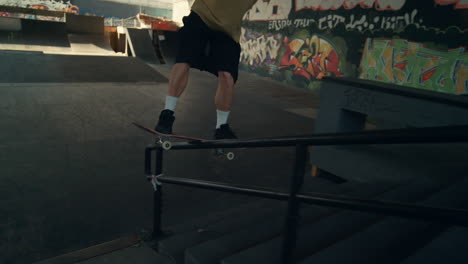 Active-teenager-skateboarding-at-skate-park.-Close-up-man-riding-on-skate-board