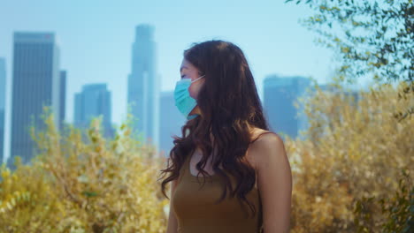 Woman-wearing-medical-mask-outdoor-closeup.-Asian-girl-cover-face-against-covid