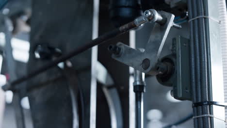 Manufacture-machine-part-rotating-at-technological-conveyor-automat-line-closeup