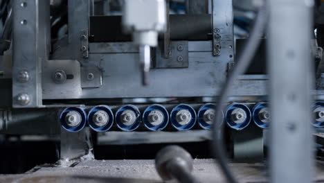 Closeup-conveyor-belt-mechanism-working-at-manufacture-moving-production