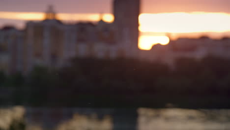 Defocused-cityscape-at-sunrise-drone-shot.-Blocks-of-flats-in-residential-area.