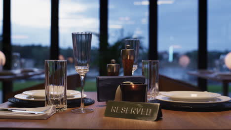 Reserved-restaurant-table-empty-in-luxury-design-bar-cafeteria.-Dinner-concept.