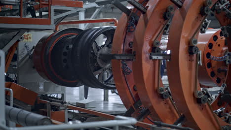 Automated-robotic-tire-manufacture-machine-moving-at-automotive-workshop