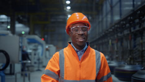 African-american-worker-smiling-at-modern-digital-production-factory-portrait