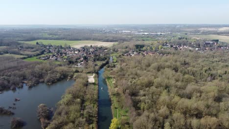 Drone-flies-high-above-the-River-Great-Stour-towards-the-small-village-Fordwich,-England