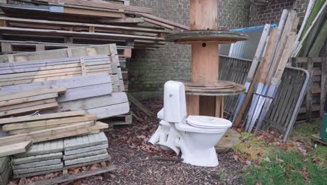A-white-toilet-abandoned,-dumped,-left-behind-outside
