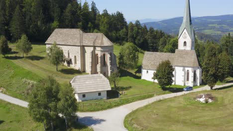 Forward-aerial-drone-shot-of-historical-church-in-Slovenia