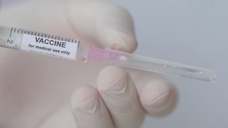 Hypodermic-Injection-With-Vaccine-Fluid-Placing-Needle,-Close-Up-Shot