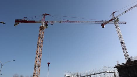 High-tower-cranes-work-on-building-site