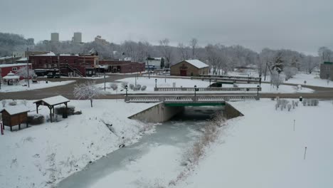Tiny-bridge-over-frozen-river-in-small-American-county-town