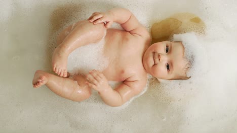 top-view-of-baby-girl-in-a-dream-lying-in-the-bathroom