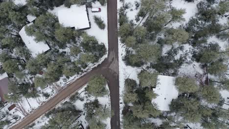Top-down-aerial-shot-lowering-over-a-rural-back-road-in-Arizona