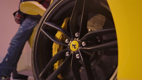Close-up-of-a-Ferrari-rim,-the-Ferrari-is-yellow