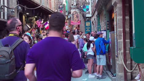 The-main-shopping-street-of-Mont-Saint-Michel-is-filled-up-with-visitors-and-shoppers