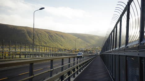 Walking-Across-The-Tromso-Bridge-During-Misty-Morning-Of-Autumn-In-Norway