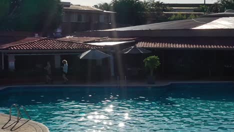 People-enjoying-swimming-pool-at-Double-Tree-resort-hotel,-Medium-shot