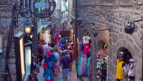 People-carrying-flags-and-tourists-are-walking-through-the-main-shopping-street