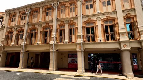 Row-of-Traditional-Building-with-Colorful-Facades-in-Singapore,-Pan-Shot