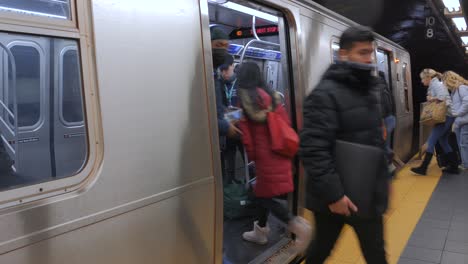 Passengers-Boarding-And-Getting-Off-The-Train-At-The-Platform