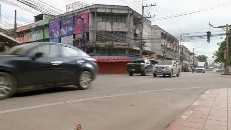 Day-time-traffic-with-low-hanging-power-lines-in-Nan-province,-Thailand