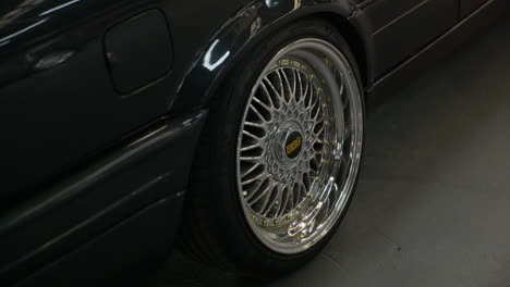 Shiny-BBS-logo-centre-cap-on-stylish-BMW-e30-wheel-alloy-at-Barcelona-fan-car-show-meeting