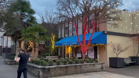 Structures-With-Christmas-Lights-Decor-During-Sunrise-In-Ashland-Downtown,-Oregon,-USA