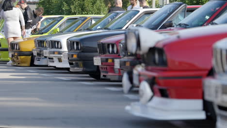 Focusing-across-BMW-e30-classic-car-collection-and-owners-gathered-at-Barcelona-fan-meeting