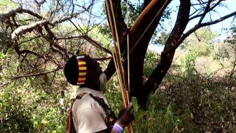 African-Hadzabe-tribe-family-hunting-in-group-with-bows-and-arrows-in-the-savannah