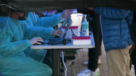 Residents-go-through-Covid-19-coronavirus-testing-outside-a-building-placed-under-lockdown-at-a-public-housing-complex-after-a-large-number-of-residents-tested-positive-in-Hong-Kong