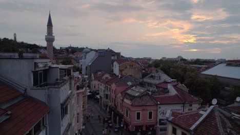 Picturesque-old-town-city-of-Plovdiv,-flying-above-street-with-Djumaya-Mosque