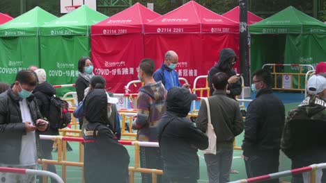 Citizens-queue-in-line-to-be-tested-for-Covid-19-coronavirus-outside-a-building-placed-under-lockdown-after-a-large-number-of-residents-tested-positive-in-Hong-Kong