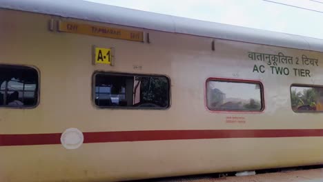 indian-passenger-express-train-leaving-station-on-track-at-evening-from-flat-angle-video-is-taken-at-kamakhya-railway-station-assam-india-on-May-22-2022