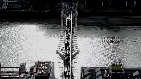 View-of-Pedestrians-Crossing-The-Millennium-Bridge-from-St-Paul's-Cathedral,-London,-United-Kingdom