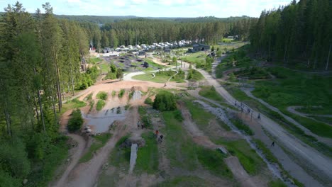 Aerial-dolly-above-mountain-bikers-at-Isaberg-mountain-resort-Sweden