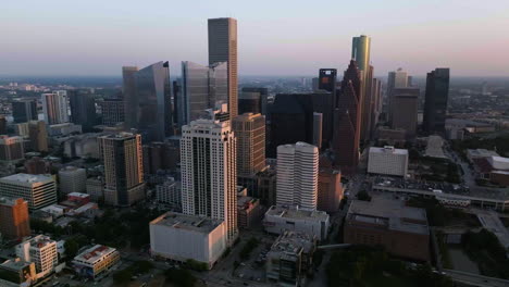 Aerial-view-around-the-downtown-Houston-skyline,-sunny-morning-in-Texas,-USA