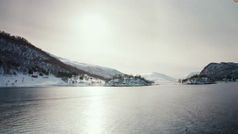 Wide-Static-Shot-of-Boat-Cruise-Sailing-along-the-Arctic-Fjords-in-Norway
