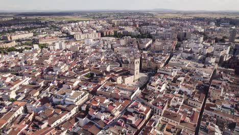 Drone-orbit-around-roman-cathedral-in-Badajoz-Spain,-medieval-old-town-skyline
