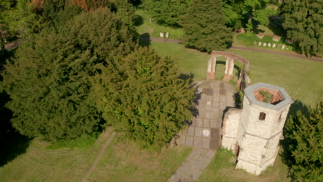 Descending-aerial-shot-over-crumbling-old-church-holy-ghost-cemetery-Basingstoke