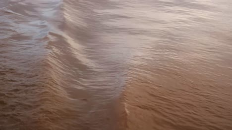
Close-up-shot-of-turbulent-waves-of-brown-water,-Amazon-River-Manaus-Brazil