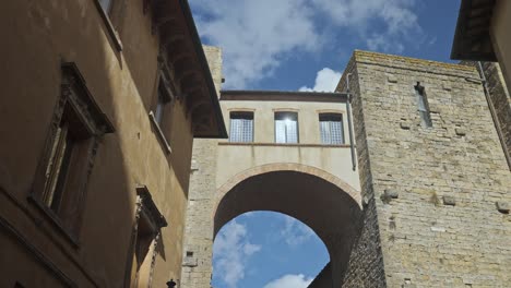 Looking-up-at-the-architecture-of-the-old-walled-town-of-Volterra,-Province-of-Perugia,-Italy