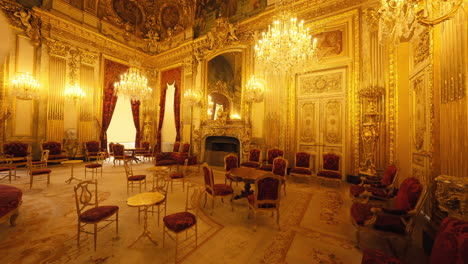 Slow-motion-establishing-shot-of-antique-red-velvet-chairs-and-tables-within-the-Louvre-Museum