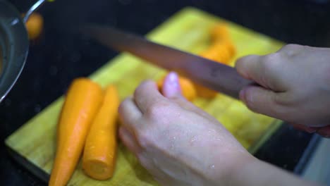 cutting-the-carrot-on-the-worktop