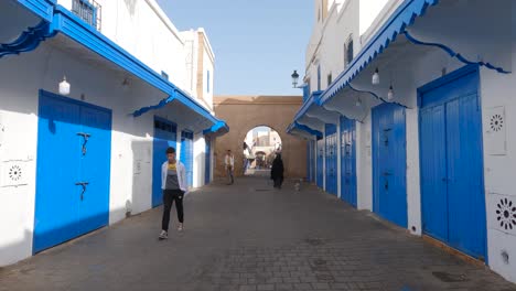 Pov-forward-dolly-of-colorful-wooden-doors-in-Essaouira-Medina