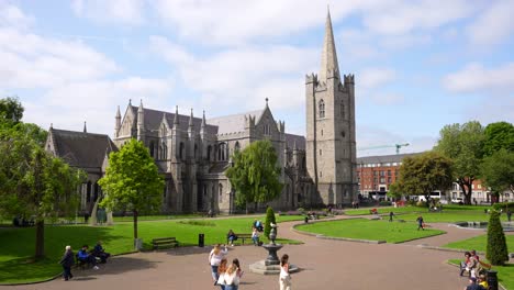 Establishing-shot-of-people-walking-in-St-Patrick's-Cathedral-square,-Dublin
